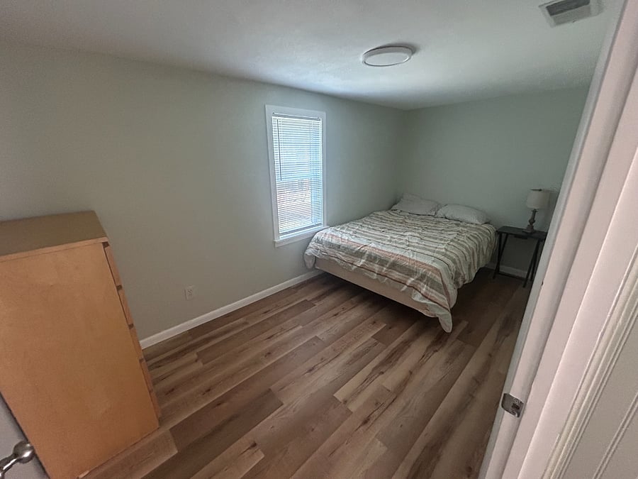 Queen Bedroom with a dresser and closet