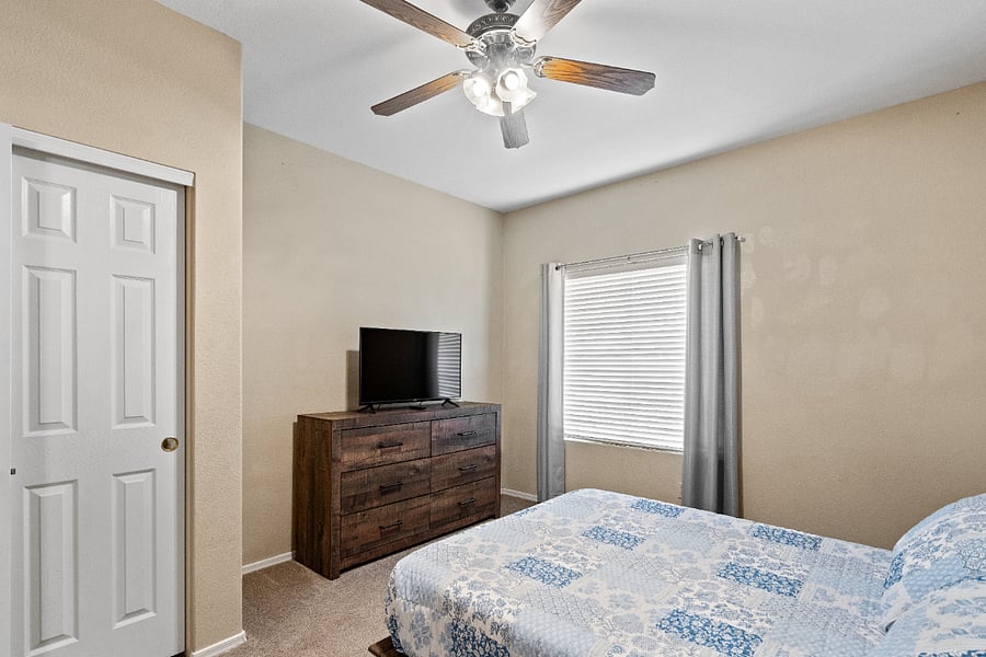 The downstairs bedroom offers a comfortable queen-size bed and is conveniently located next to the shared full bathroom, making it ideal for guests who prefer to avoid stairs.