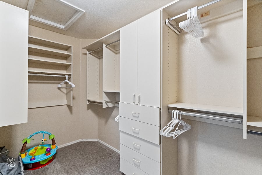 The master closet offers ample storage space for clothing and personal belongings, providing convenient organization during your stay.