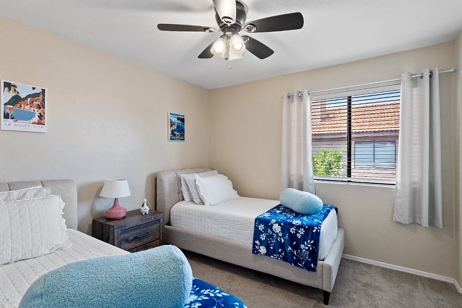 The upstairs bedroom offers two twin beds in a quiet settingideal for a restful nights sleep. It shares a Jack-and-Jill style full bathroom with the neighboring bedroom, with access from both rooms.