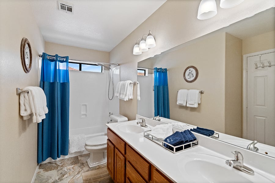 The upstairs Jack-and-Jill style full bathroom is shared by two bedrooms, with access from both rooms.