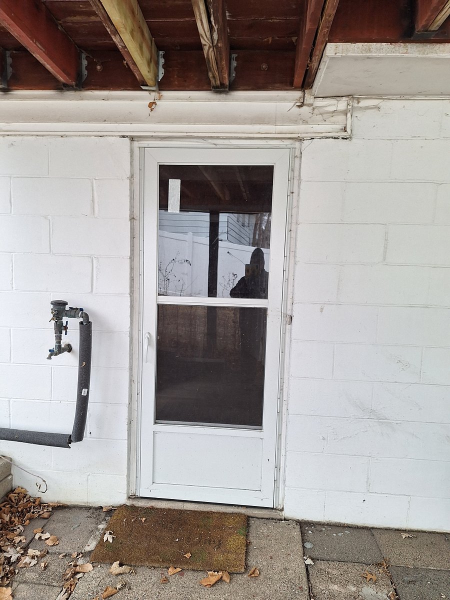 shared exterior entrance to basement ( though, this is not my main entrance, as I typically enter from the garage)