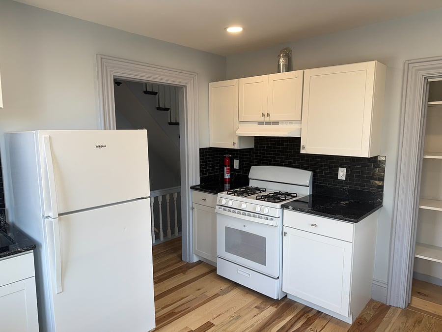 Closet in kitchen for storage. Granite counter tops.