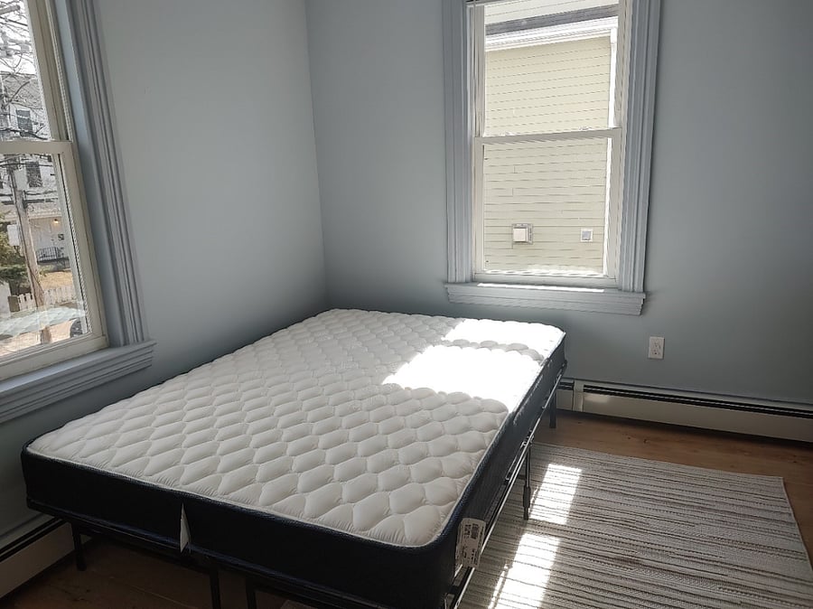 Queen sized bed in second floor bedroom