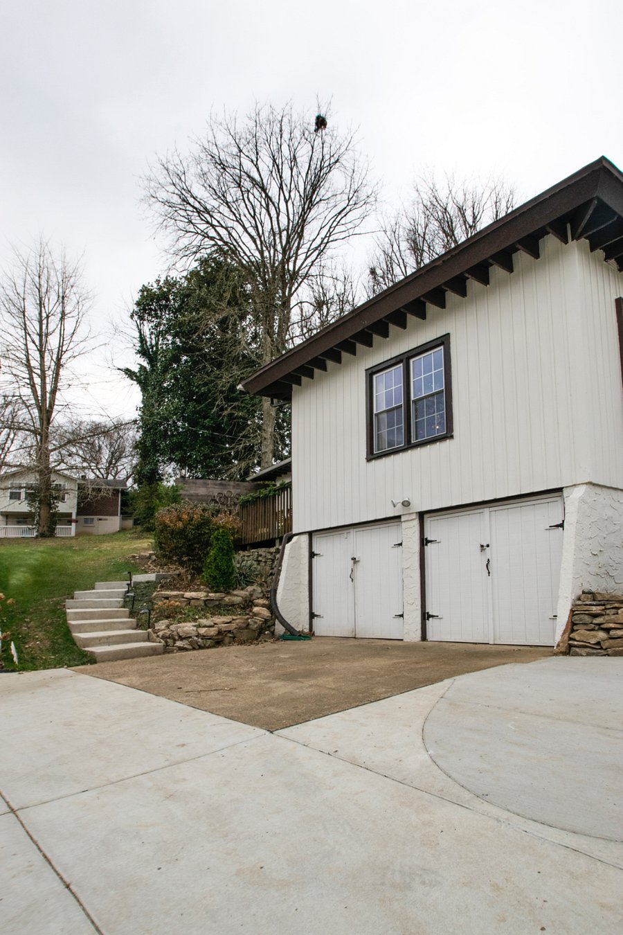 parking area and stairs leading to deck and private entrance