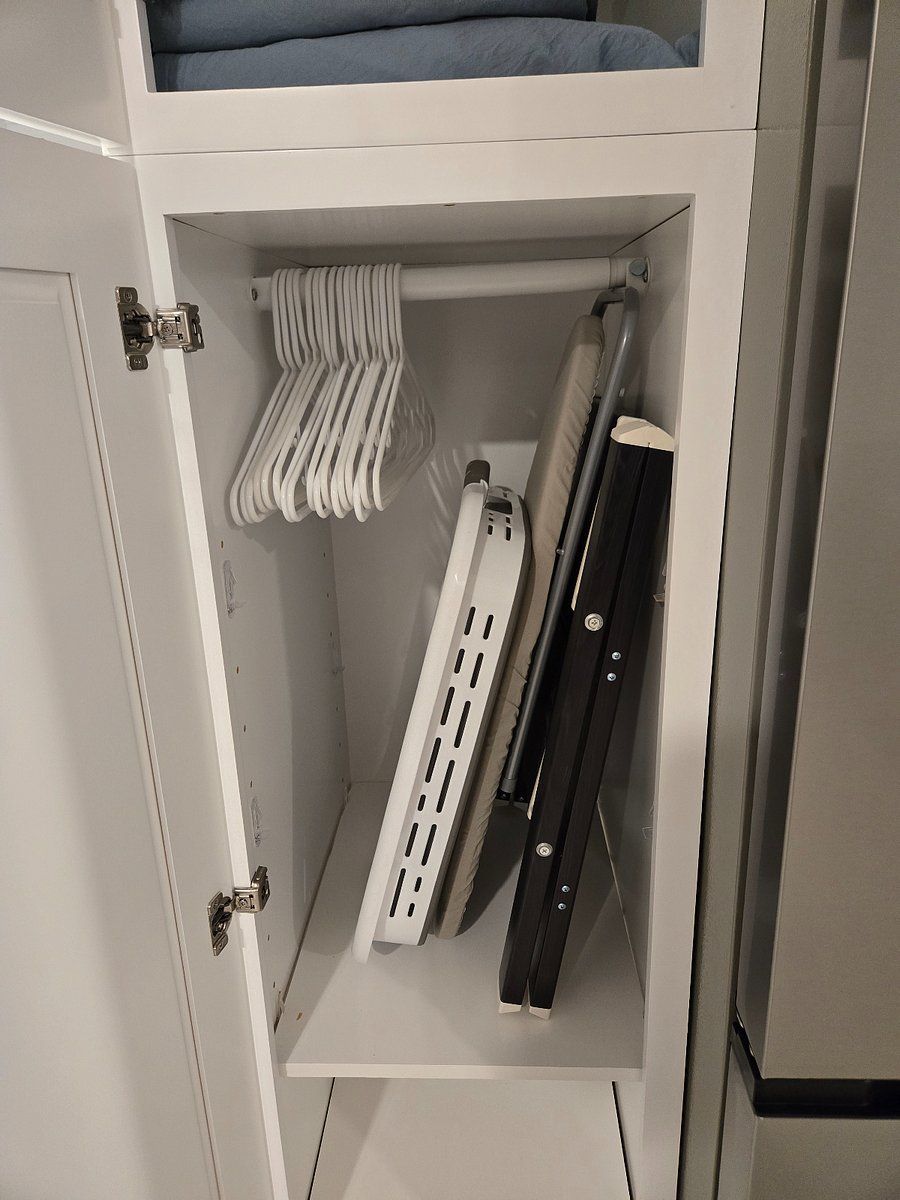 Small closet next to fridge.