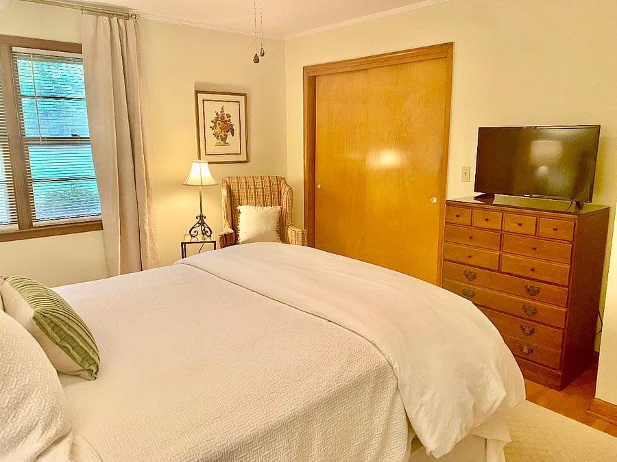 Queen bedroom with chair, TV (and Roku).
