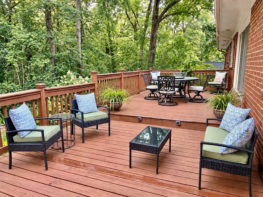 Large deck for entertaining, overlooking a large backyard.
