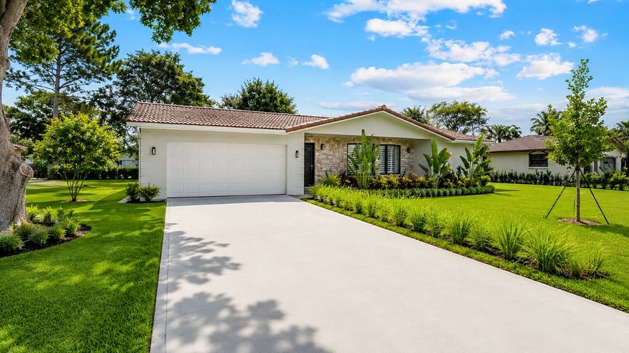 Enjoy the homes bright exterior, featuring a spacious driveway, lush tropical landscaping, and a fresh, inviting design that welcomes you into your Coral Springs retreat.
