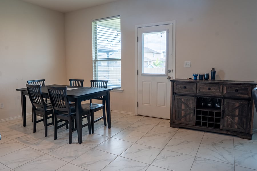 Dining Area with Seating for Four and Access to the Backyard Patio