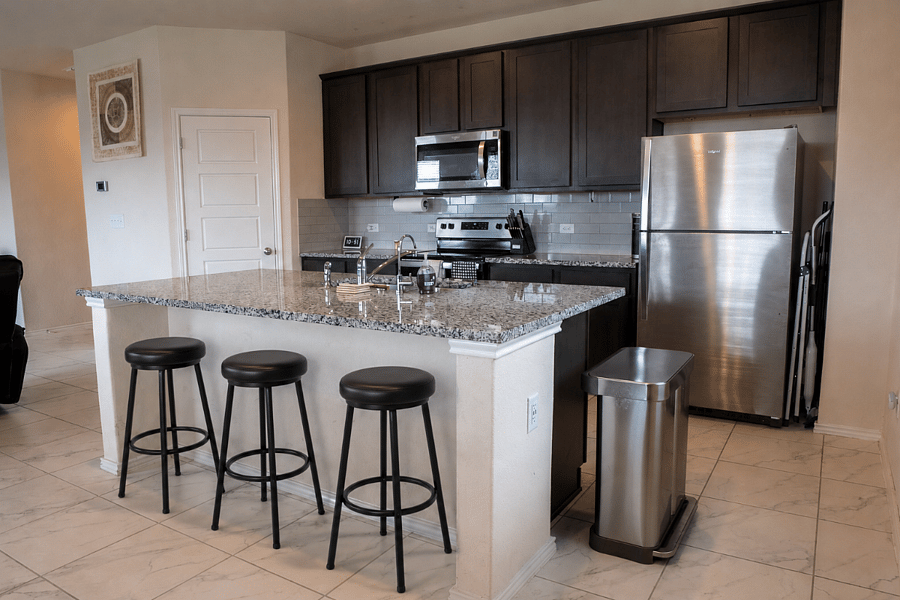 Large Center Island with Sink and Convenient Breakfast Bar Seating