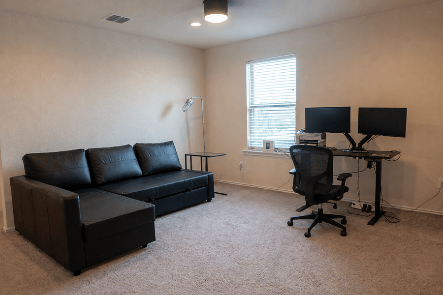 Versatile Loft with a Pull-Out Sofa and Workstation Equipped with a USB-C Docking Station for Easy Plug-and-Play Connectivity