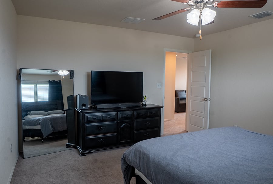 Primary Bedroom Featuring a Full-Length Mirror