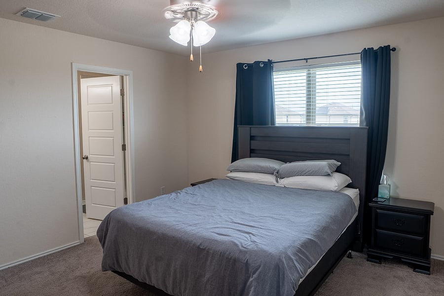 Primary Bedroom Featuring Blackout Curtains for Enhanced Privacy and Restful Sleep