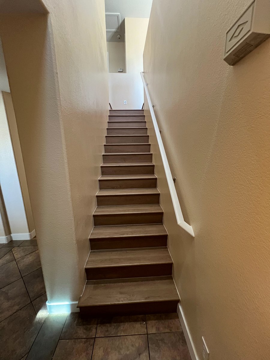 Stairs leading up to 2 Master Bedrooms & Den