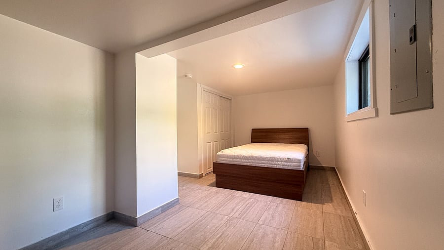 Room 1 closet location and bed with drawers underneath