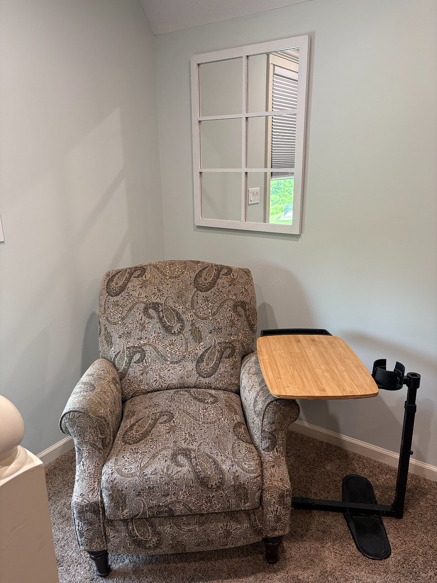 Reclining chair and adjustable table