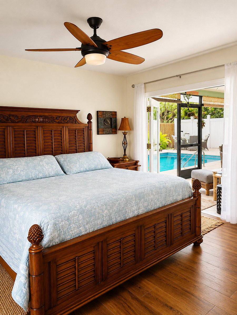 Spacious Tommy Bahama king-size master ensuite with patio doors opening to the screened lanai and pool deck. Enjoy a 72" Smart TV with live TV streaming, Prime Video, and Netflix. The private master bath features a shower with a removable handheld shower head, standard shower head, and rain shower head. The exhaust fan also includes adjustable lighting and Bluetooth.head, regular shower head and a Rain head.  exhaust fan includes different lights and bluetooth.