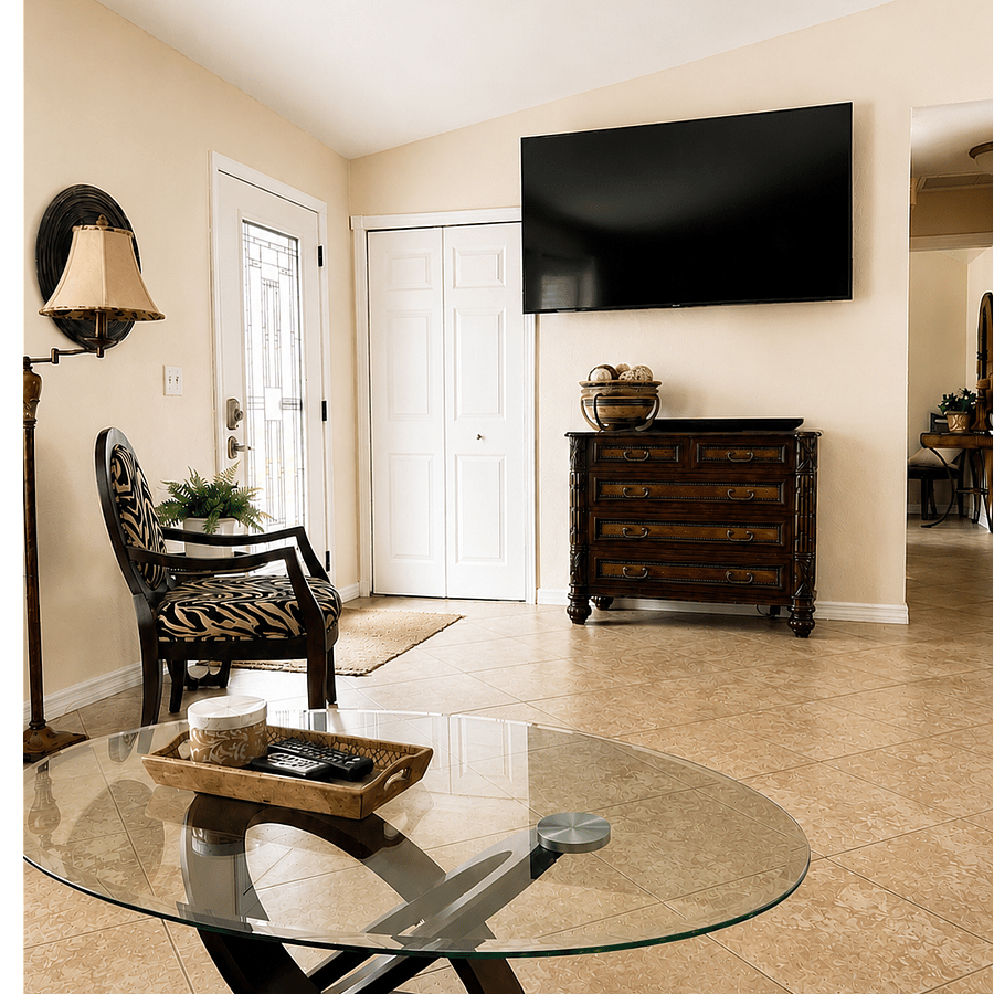 Welcoming front entry living room with cathedral ceilings and a large leather sectional featuring 2 recliners and a chaise lounge. Relax and enjoy the 72" Smart TV with live TV streaming, Prime Video, and Netflix. The front closet and dresser are stocked with family games for guests to enjoy.