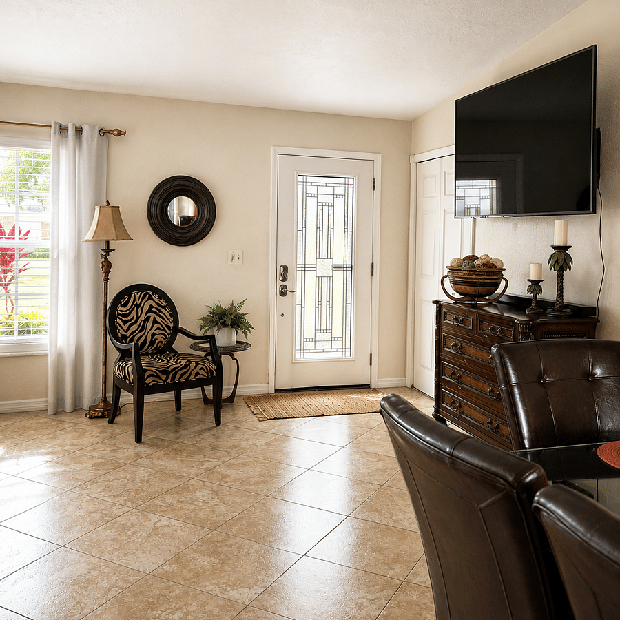 Welcoming front entry living room with a large leather sectional featuring 2 recliners and a chaise lounge. Relax and enjoy the 72" Smart TV with live TV streaming, Prime Video, and Netflix. The front closet and dresser are stocked with family games for guests to enjoy.
