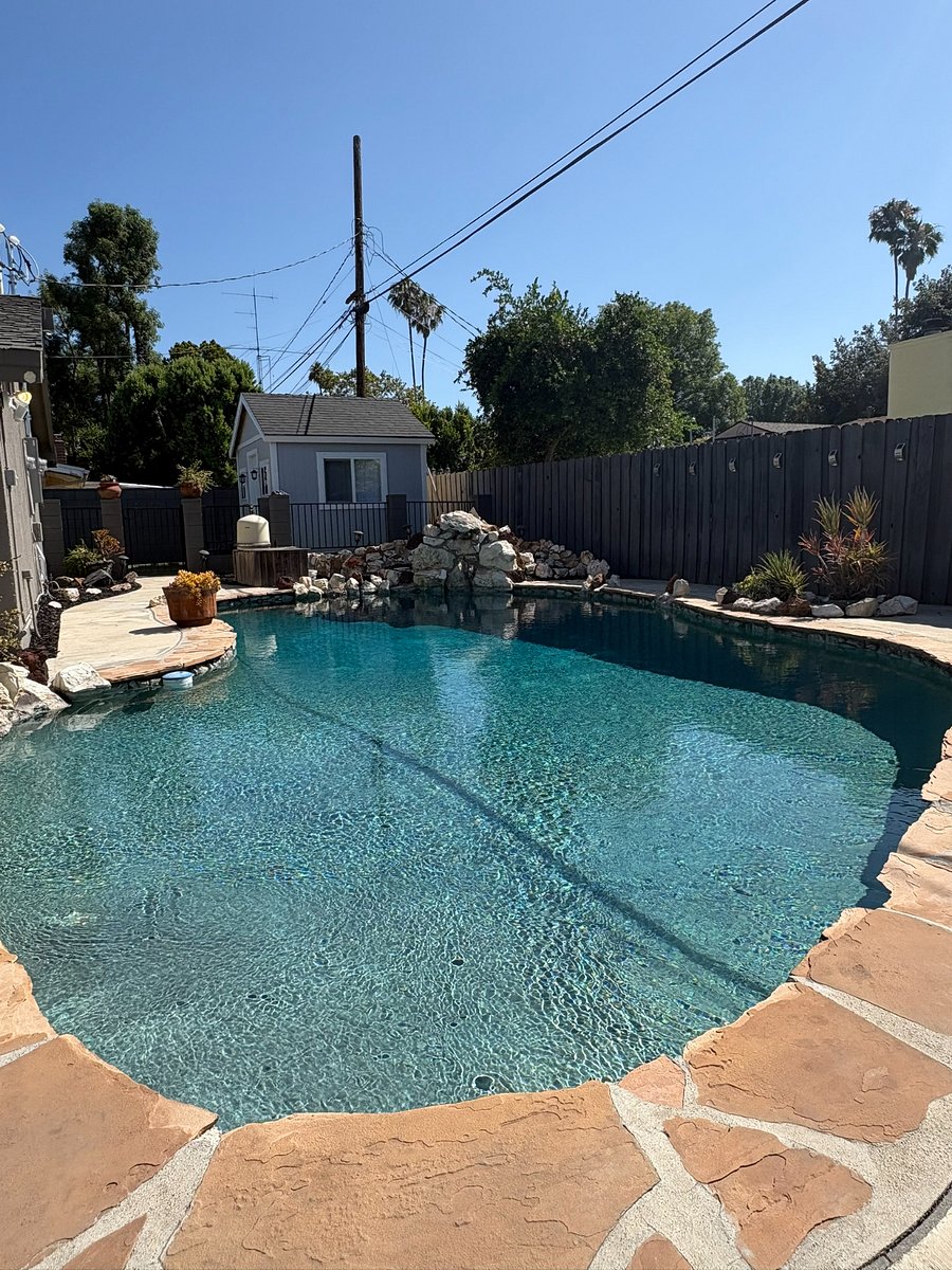 Crystal clear water, a natural rock waterfall feature and flagstone decking. Completely gated. Entirely yours.