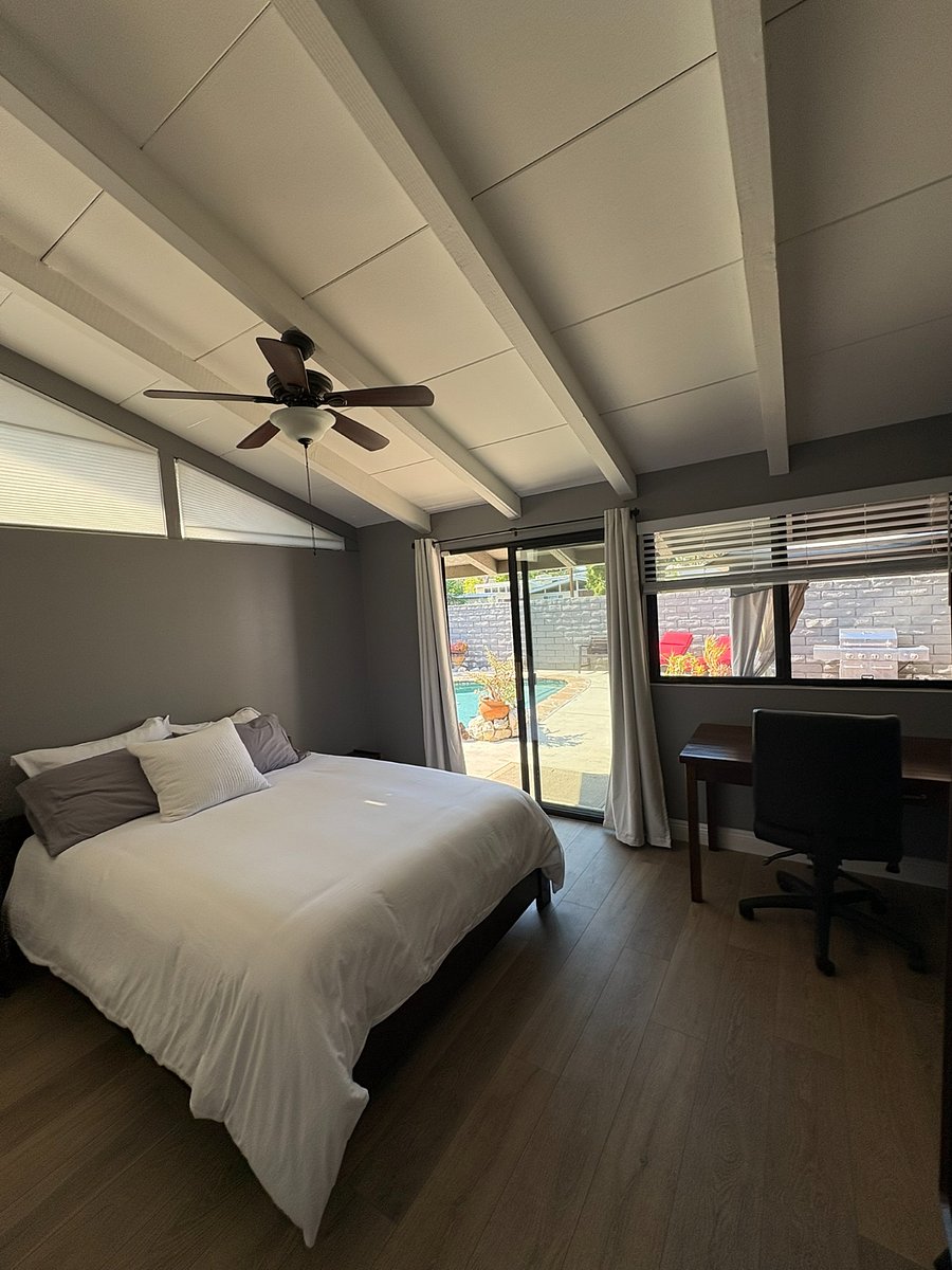 Wake up to pool views! The primary bedroom has a dedicated workstation.
