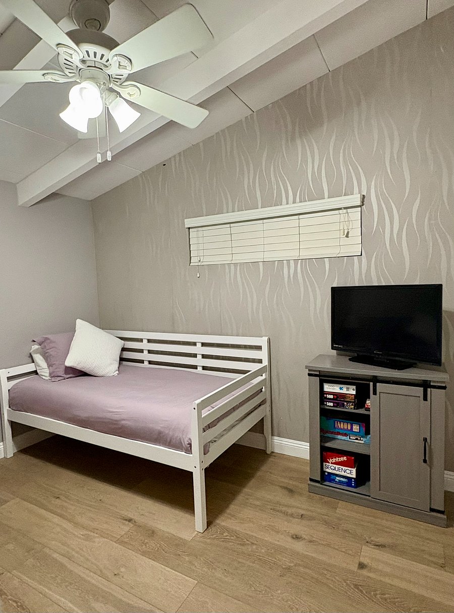 The third bedroom has an assortment of puzzles and games along with a TV.