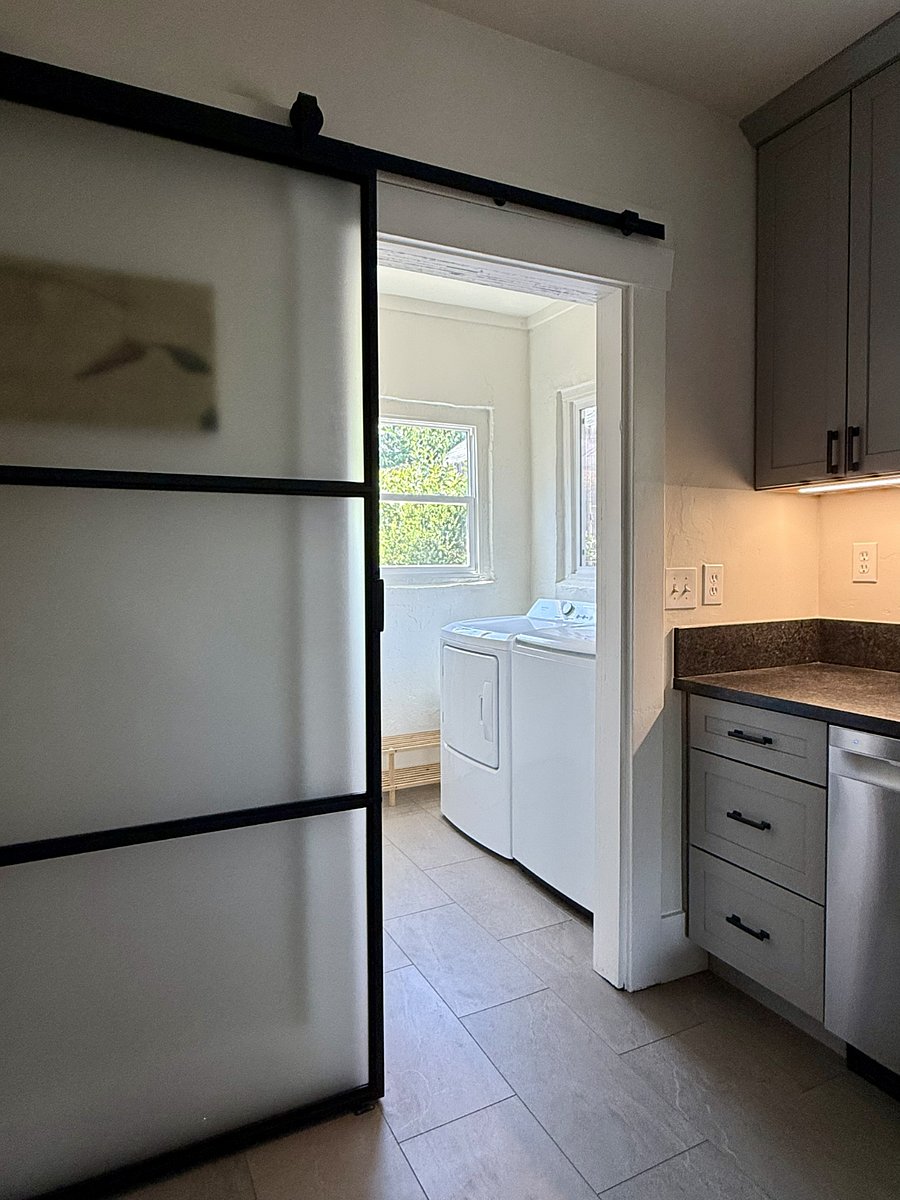 Laundry room with new washer and dryer