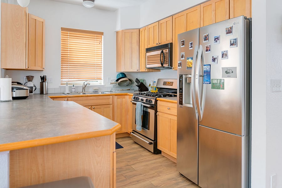 Full kitchen and stocked with pots, pans and appliances