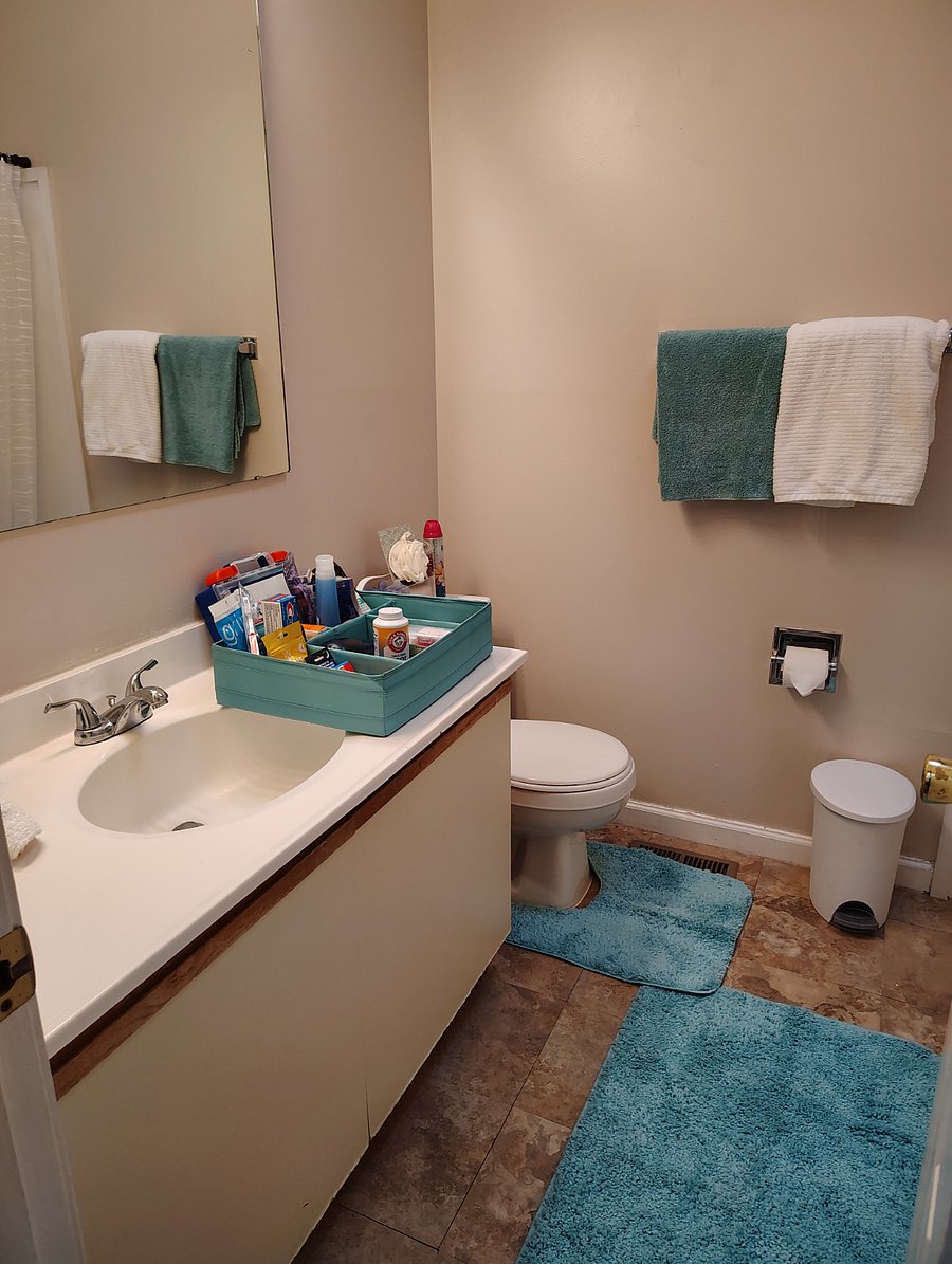 Master bathroom with towels and toiletries