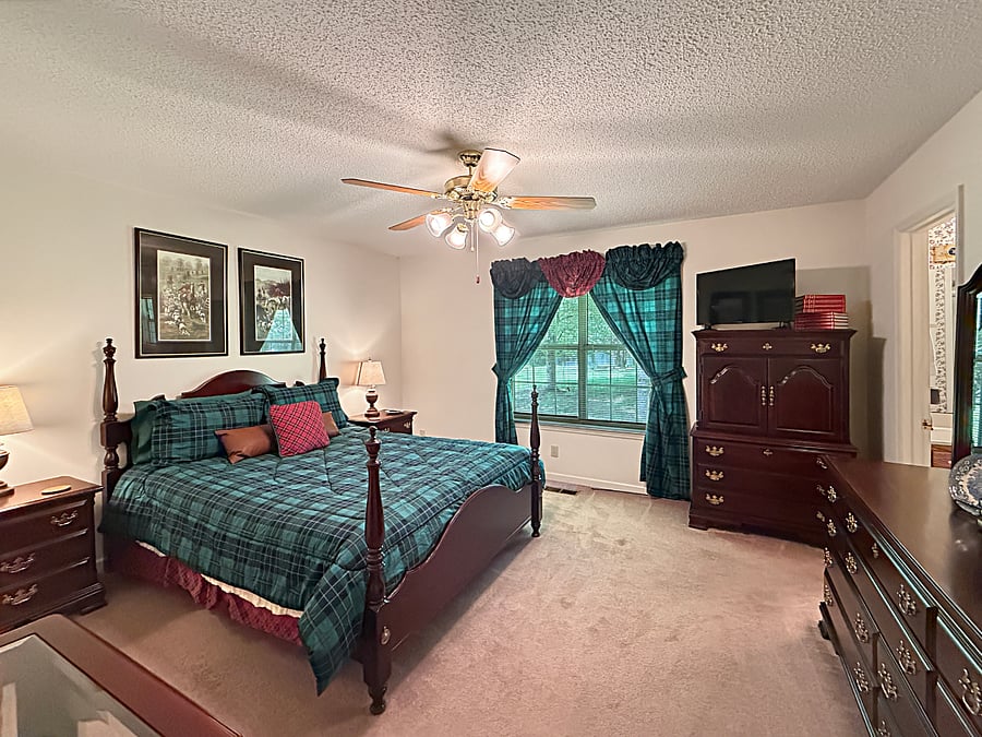 Large master bedroom with queen bed and walk-in shower ensuite bathroom
