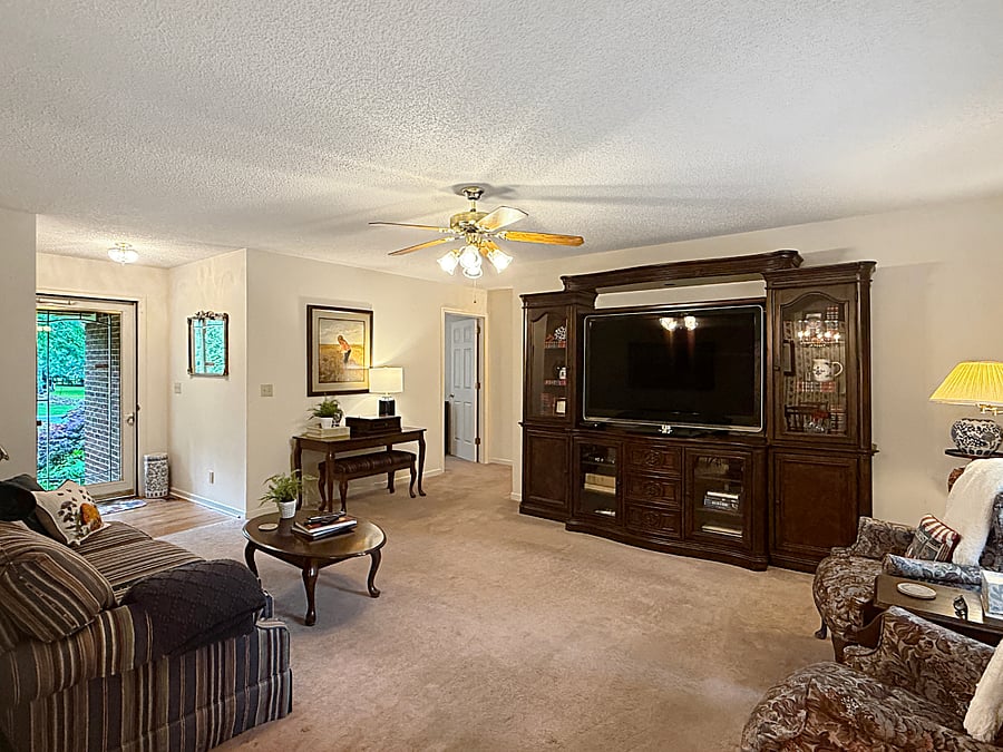 Living room with large TV and entertainment center