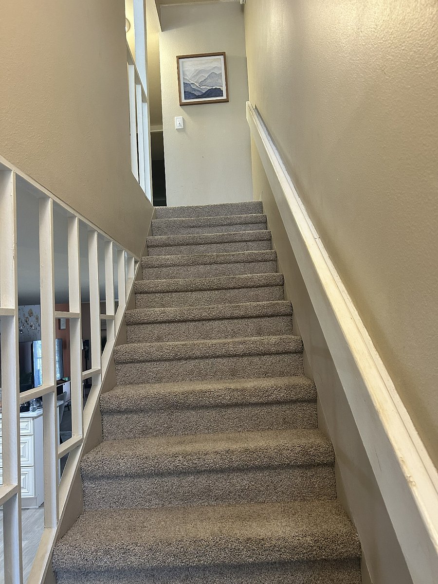Stairs to the bedrooms and bathrooms