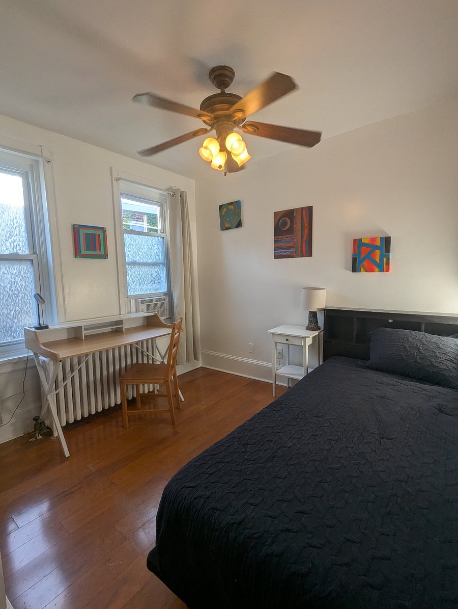 Rear bedroom - Twin XL bed, hardwood floors, desk & chair workstation, dresser with built-in closet.