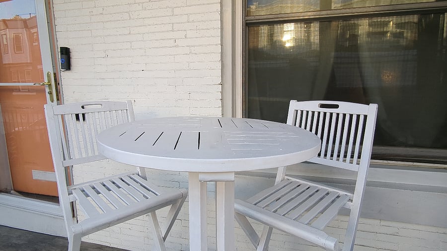 Peaceful Peach offers a small porch with seating.