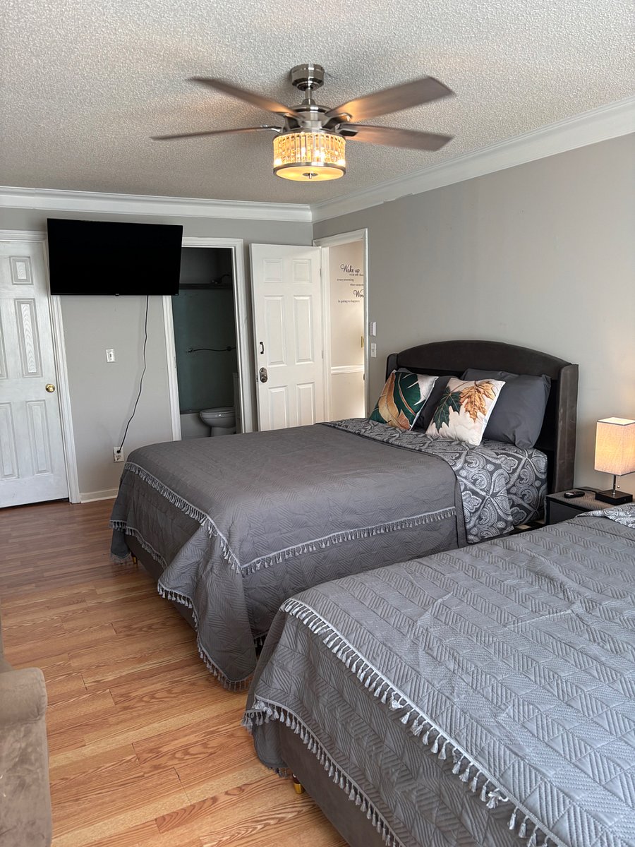 Master bedroom with two Queen beds, full bathroom, Television, Mini Refrigerator, Walk-in Closet, Keyless Entry, etc