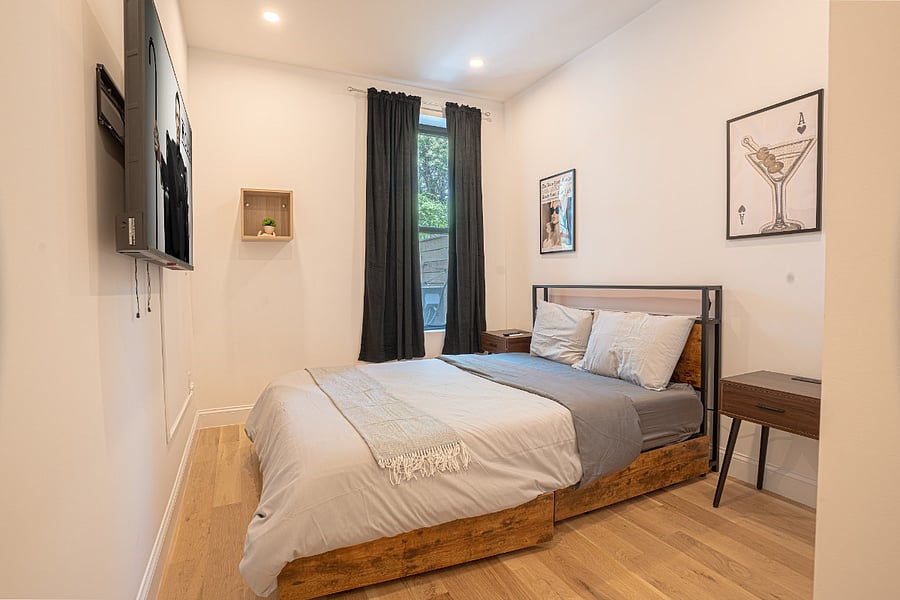 Bedroom 1 - cozy queen with crisp linens and art accents