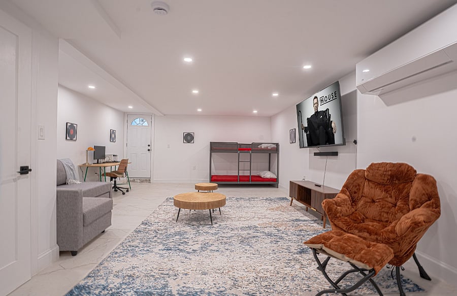 Finished basement - media lounge with bunk bed and workspace