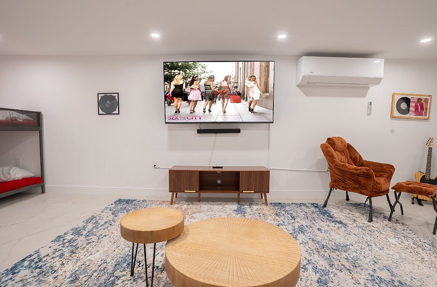 Basement den with sectional sofa and desk