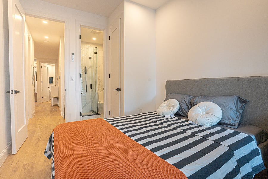 Comfortable queen bedroom with plush bedding