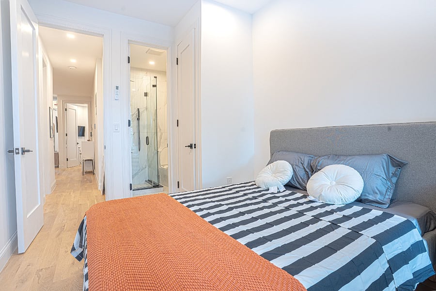 Cozy bedroom with striped duvet and warm throw