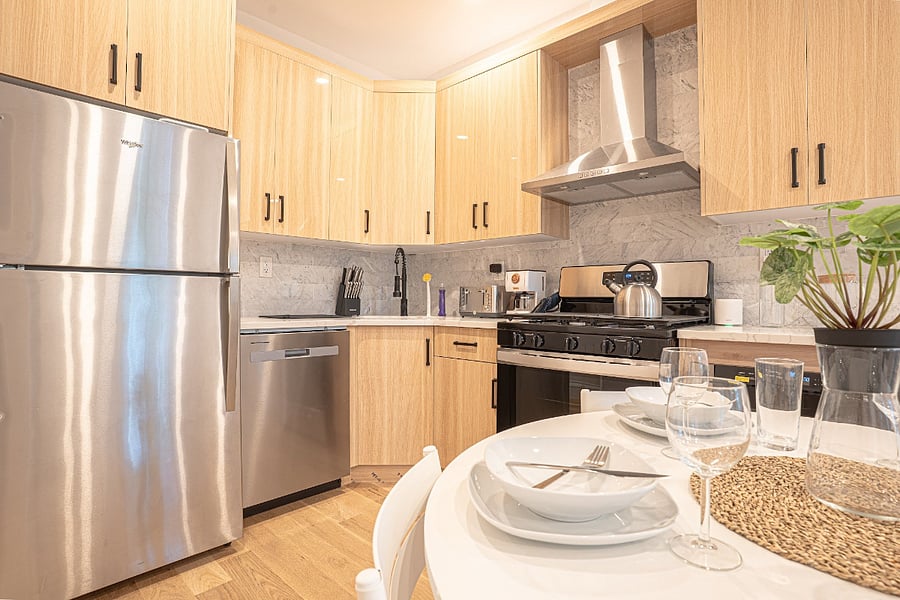 Stainless kitchen with dishwasher and gas range