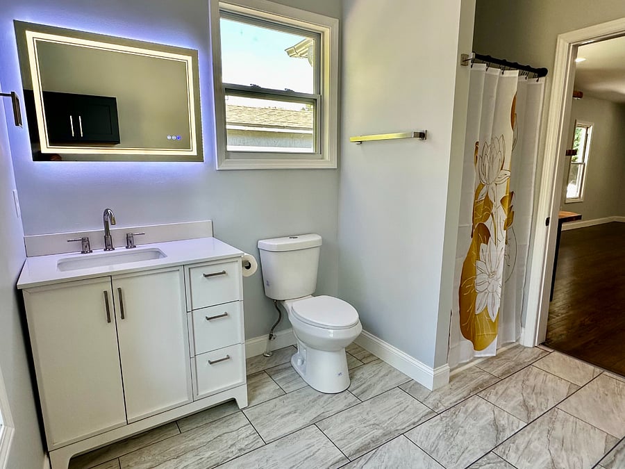 Second Bath located off Kitchen Area
