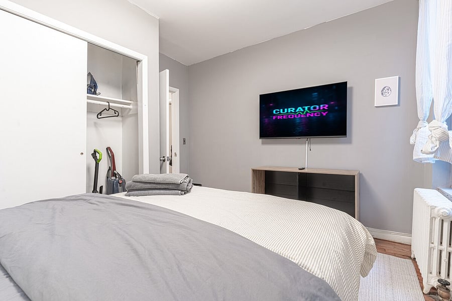 Bedroom with dedicated workspace, monitor & smart TV  remote-work ready