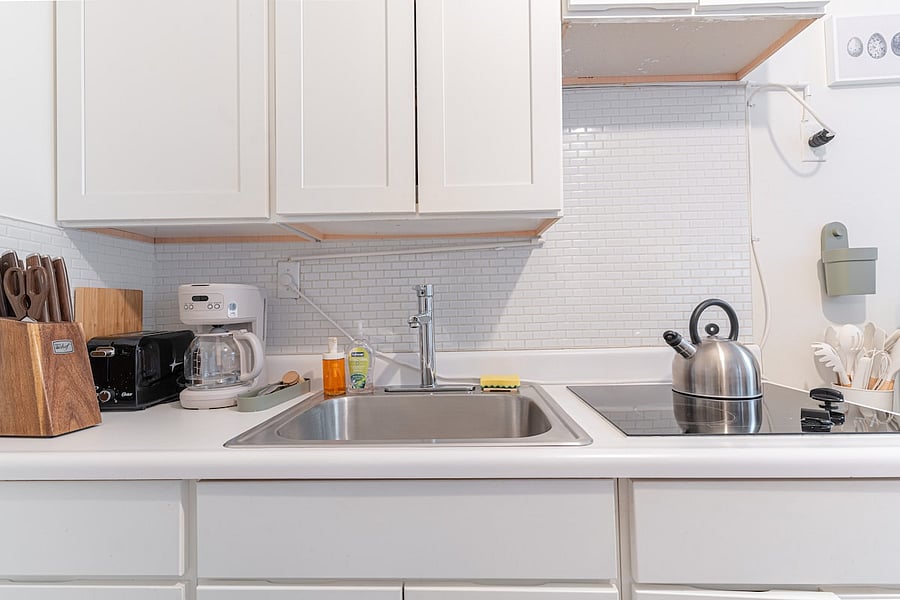 Kitchen counter with knife block, coffee maker & stainless sink