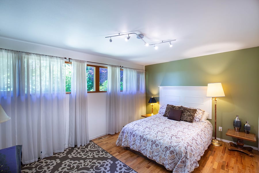 One of the two bedrooms with Queen beds on Main Floor off the living room
And kitchen 