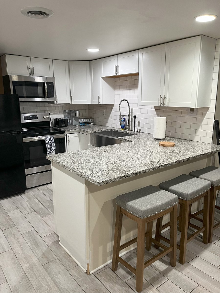 Fully equipped kitchen with stainless steel appliances, granite countertops, and everything you need to cook or reheat with ease.