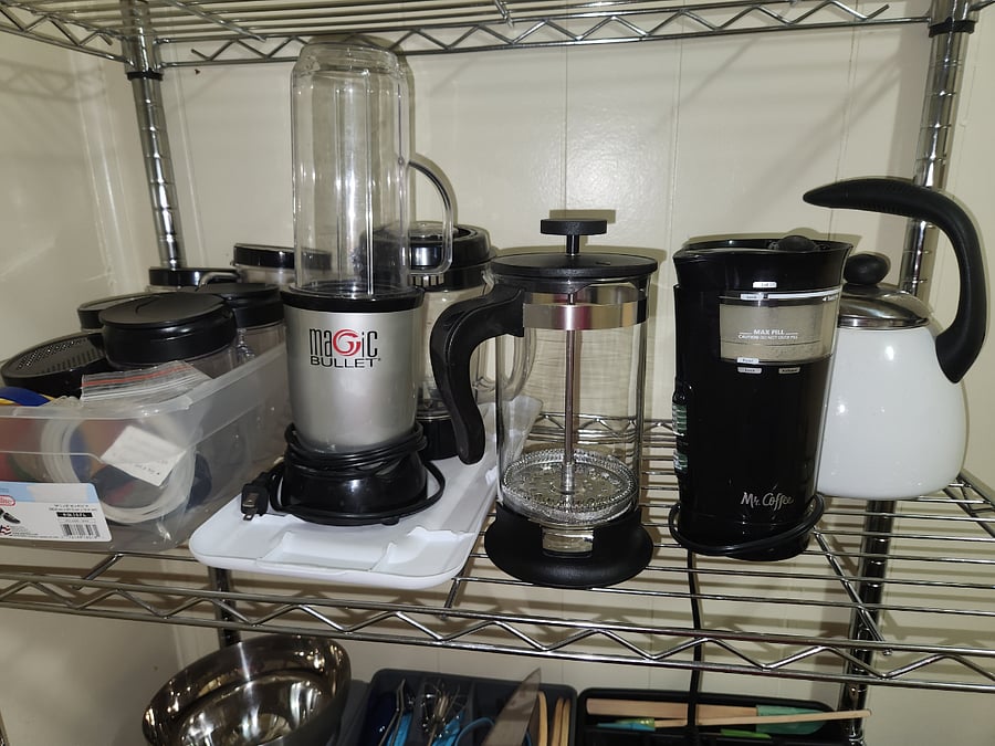 Close up of Blender equipment, kettle, coffee grinder, french press.