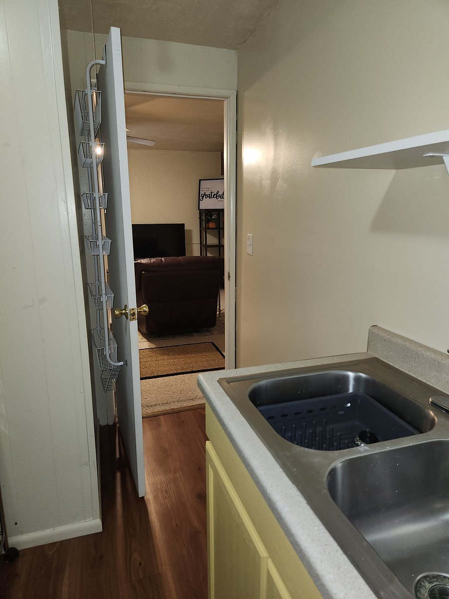 Door from kitchenette to living room