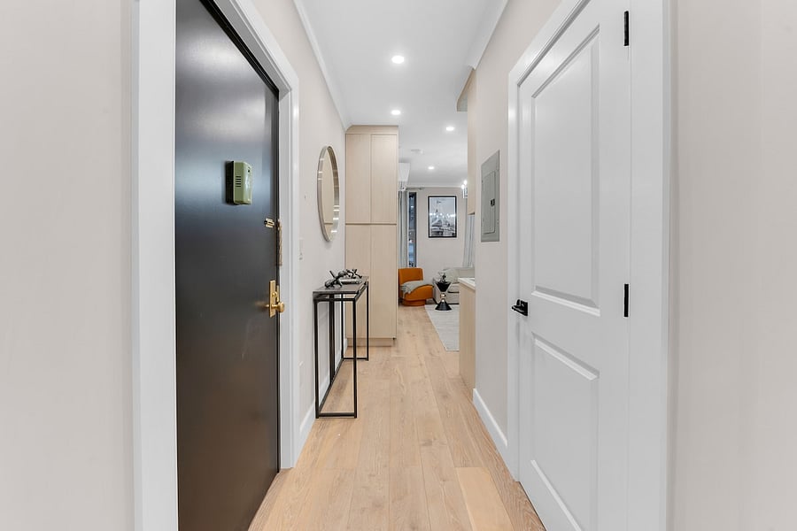 Bright private entry with console and mirror  fresh, contemporary finishes throughout.